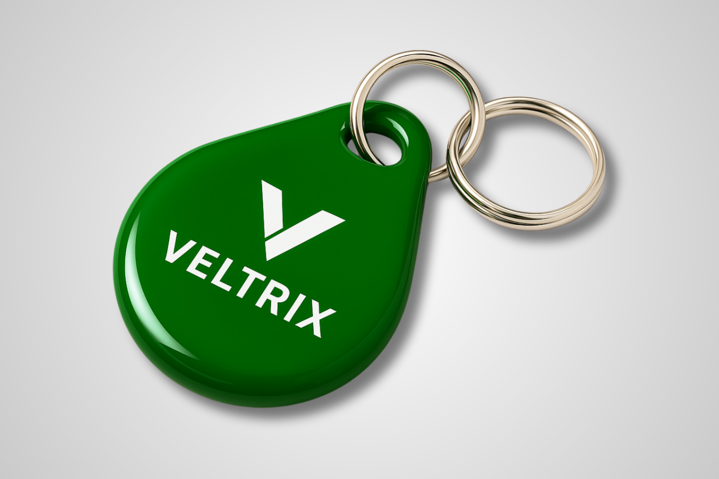 Une photo d'un porte-clés vert avec RFID et impression