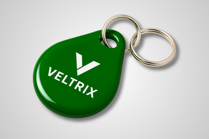 Une photo d'un porte-clés vert avec RFID et impression