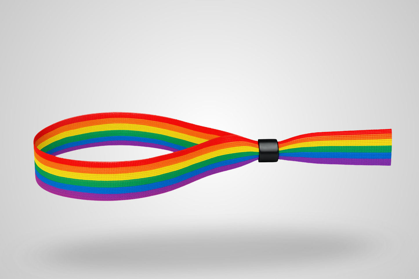 Une photo d'un bracelet en tissu avec motif de couleurs arc-en-ciel pour la fierté