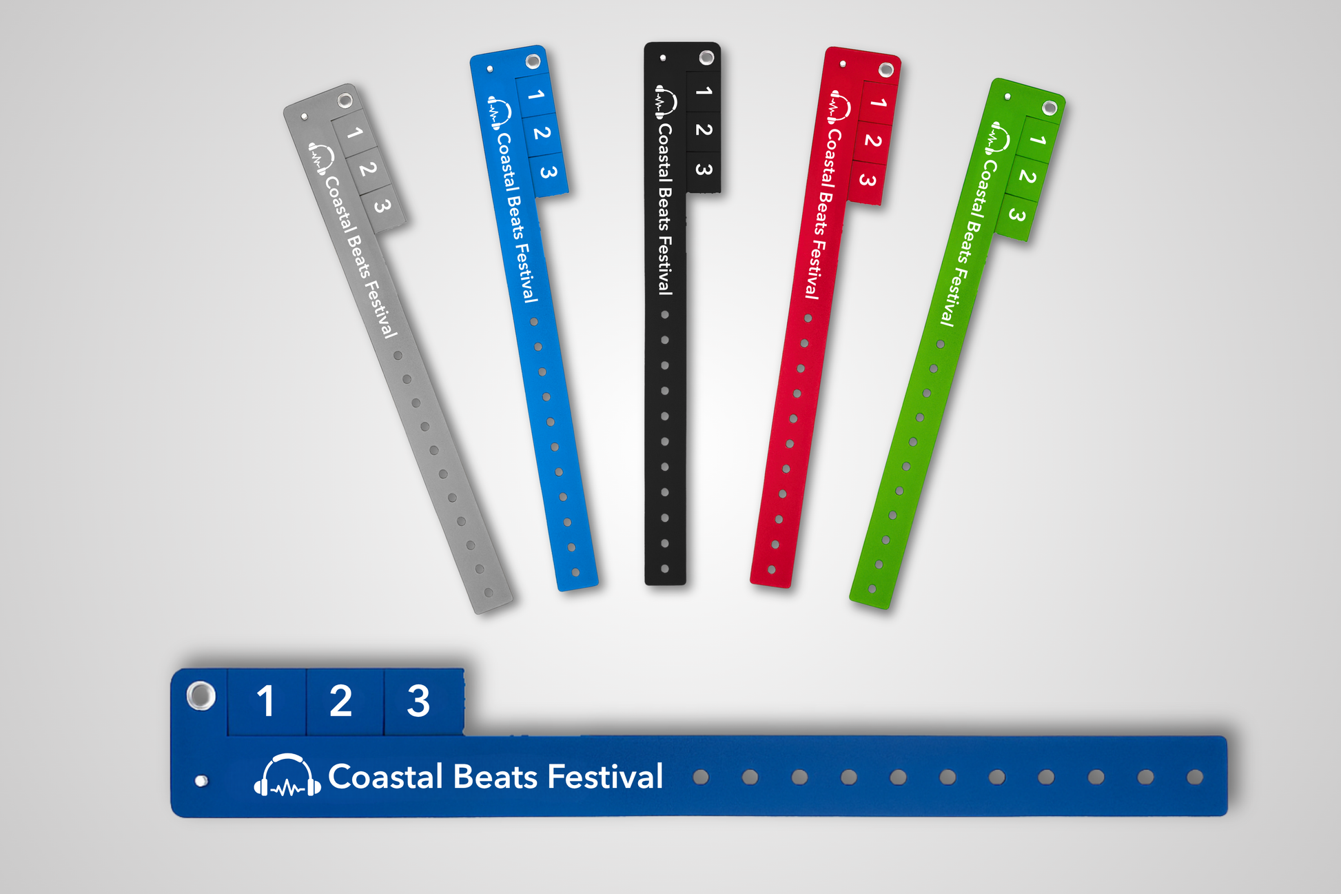 Une photo de bracelets d'entrée avec billets détachables en différentes couleurs